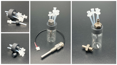 A collage of four photos, each showing a different insert into the g1/8 hole. 1) our default closed plug, 2) our additional silicone tube plug, 3) a metal barb, 4) a thermowell